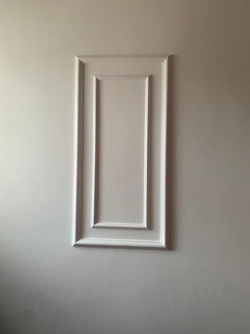 Close detail of a crisp painted wall panel and trim finish